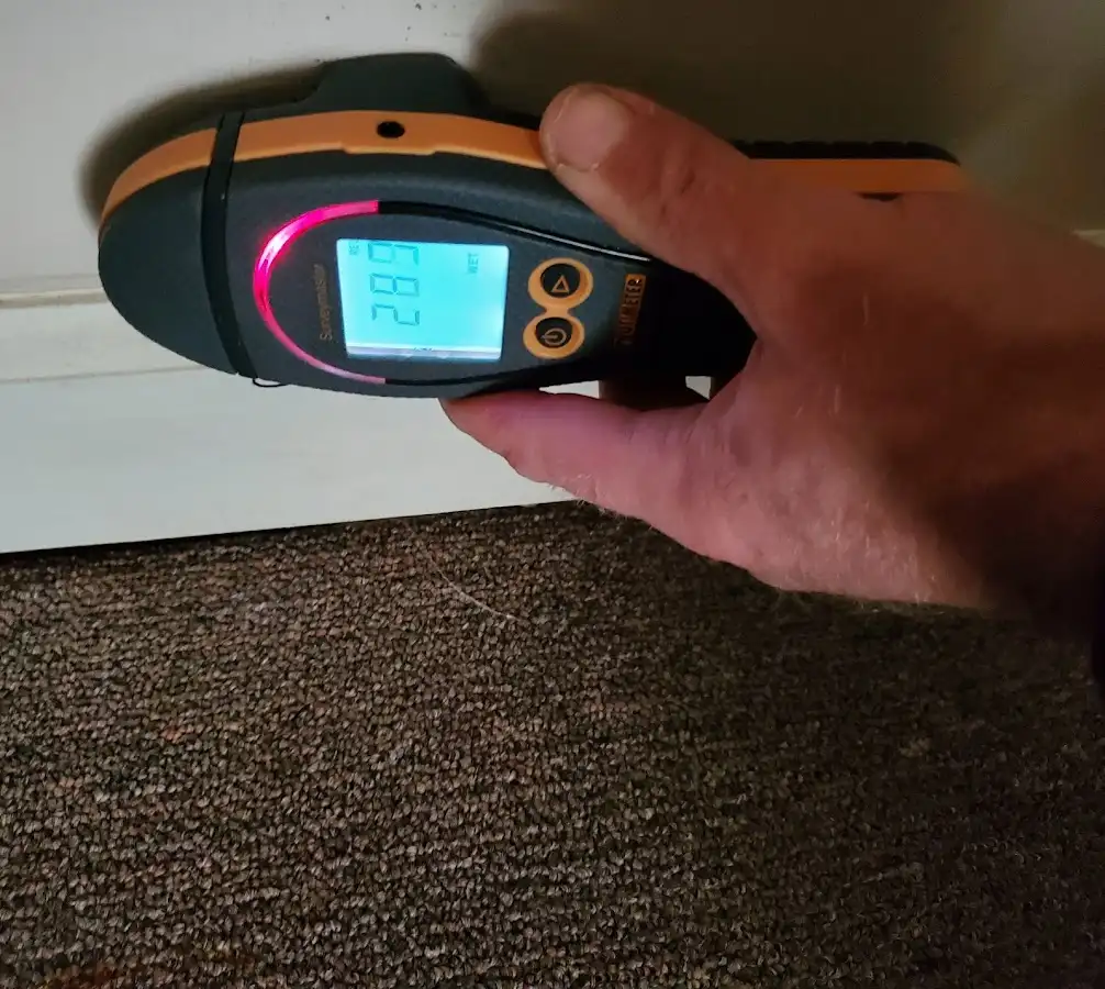Moisture detection at baseboard during Storm Damage Restoration in Barnstead